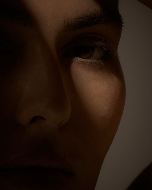 Close-up of a person's eye with a dark filter