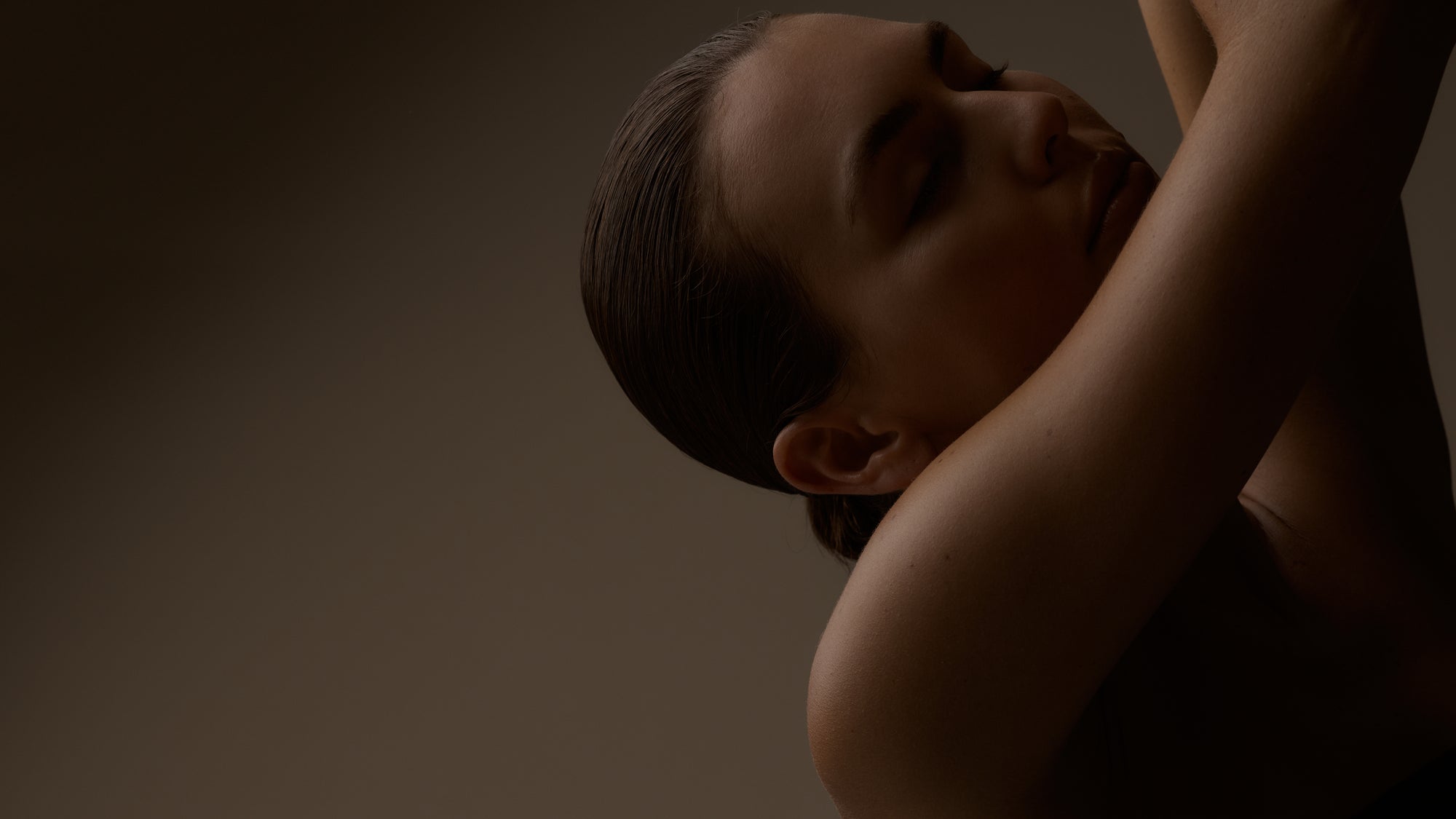 Silhouette of a person against a dark background