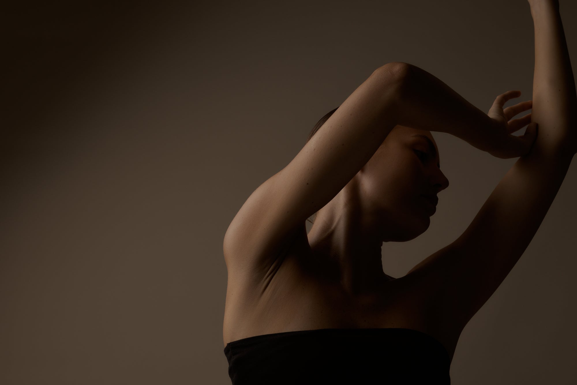 Silhouette of a person against a dark background