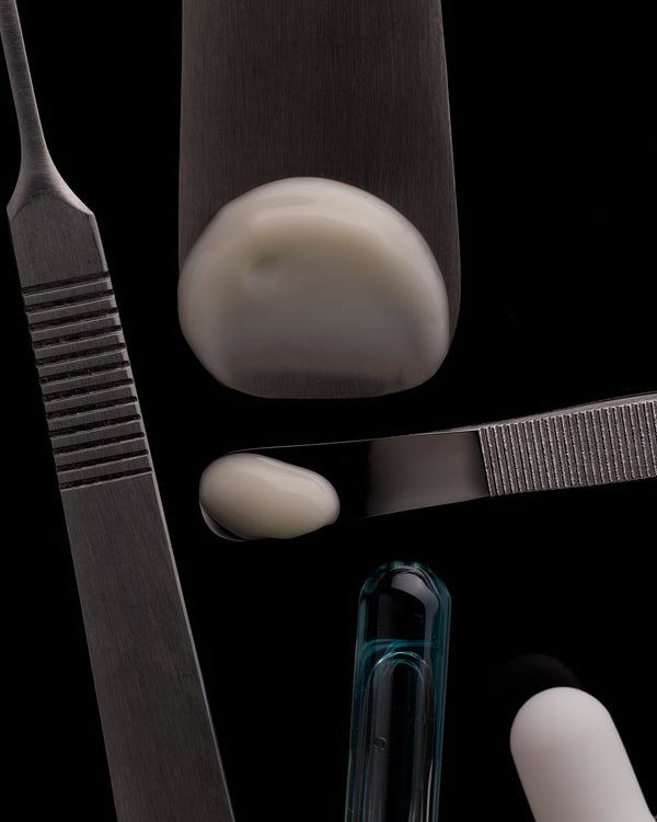 Close-up of scalpel tools and materials on a black background
