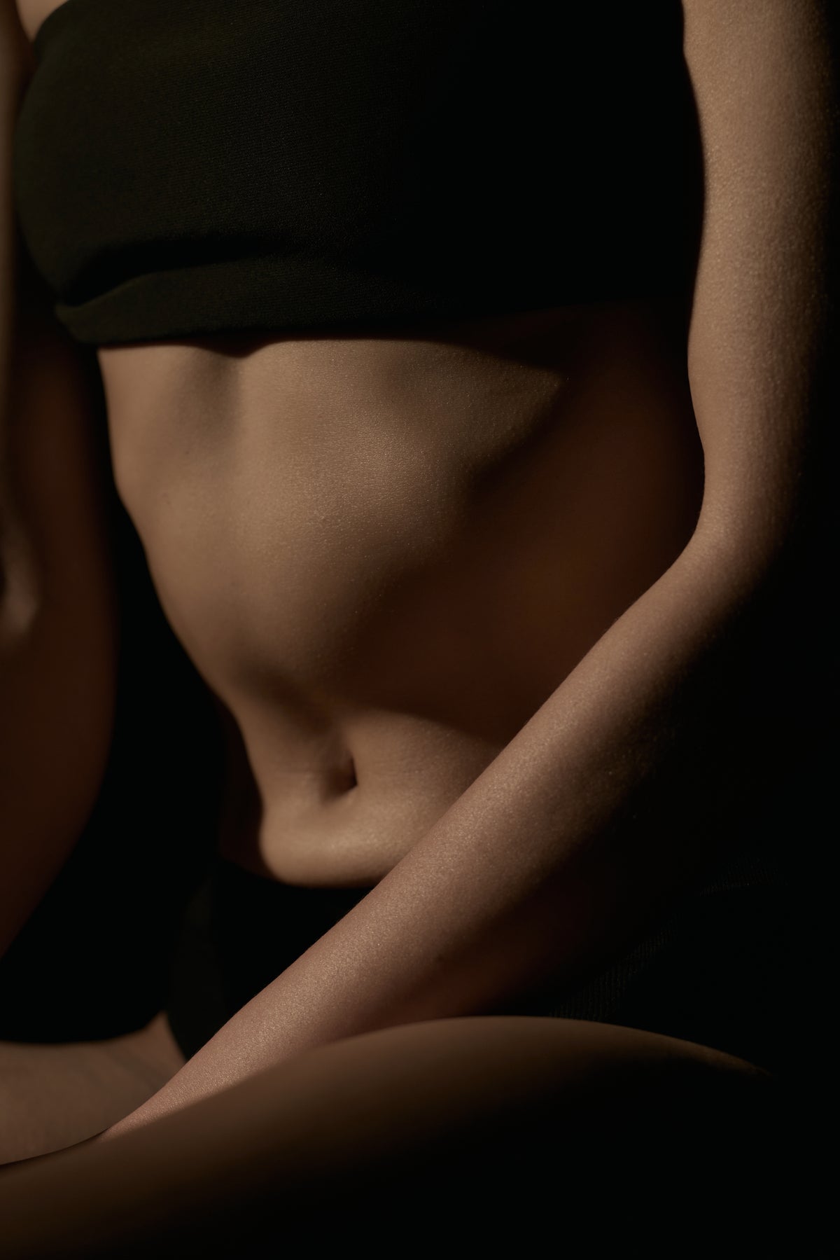 Close-up of a person's torso in sepia tones