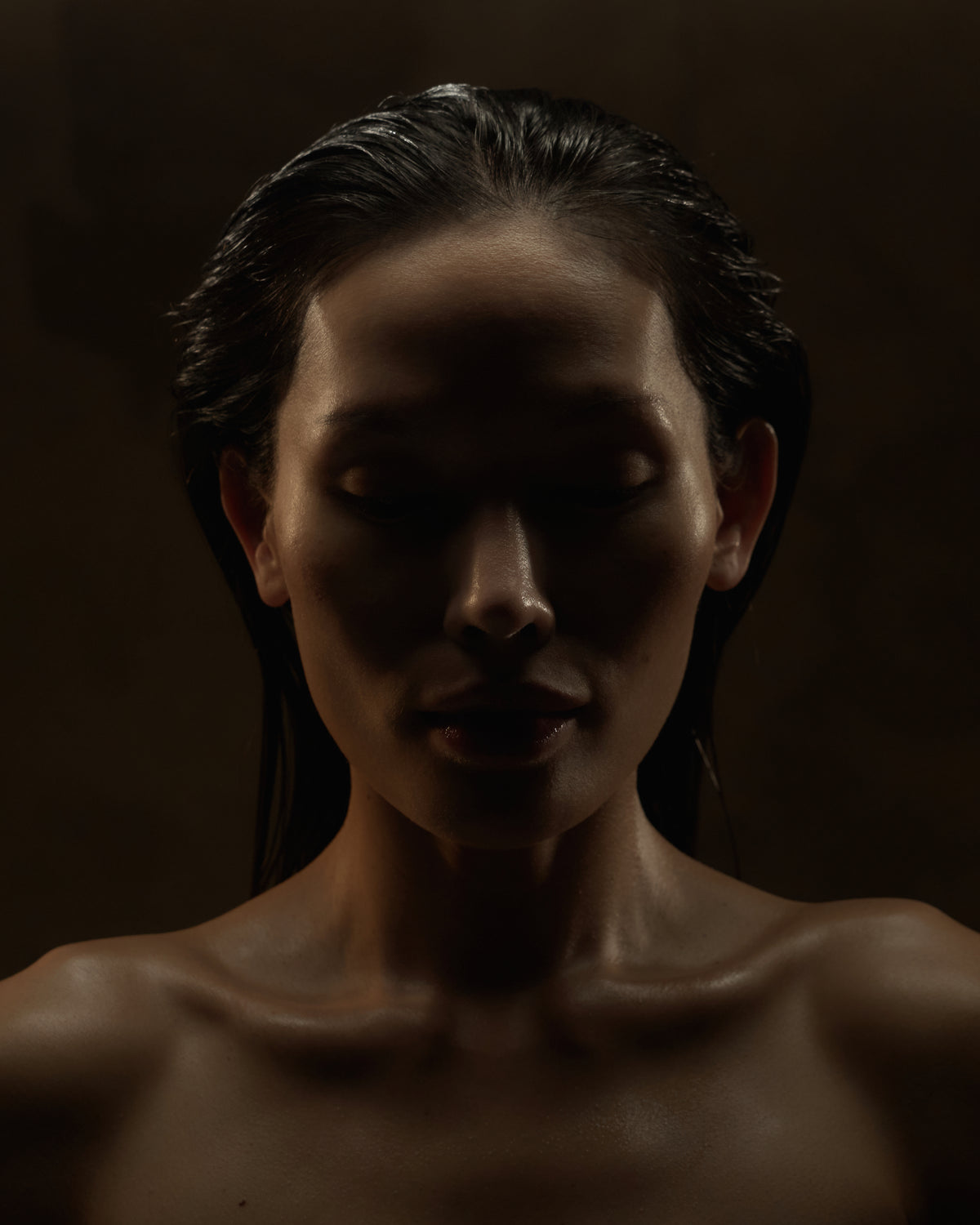 Dark portrait of a person with a blurred background